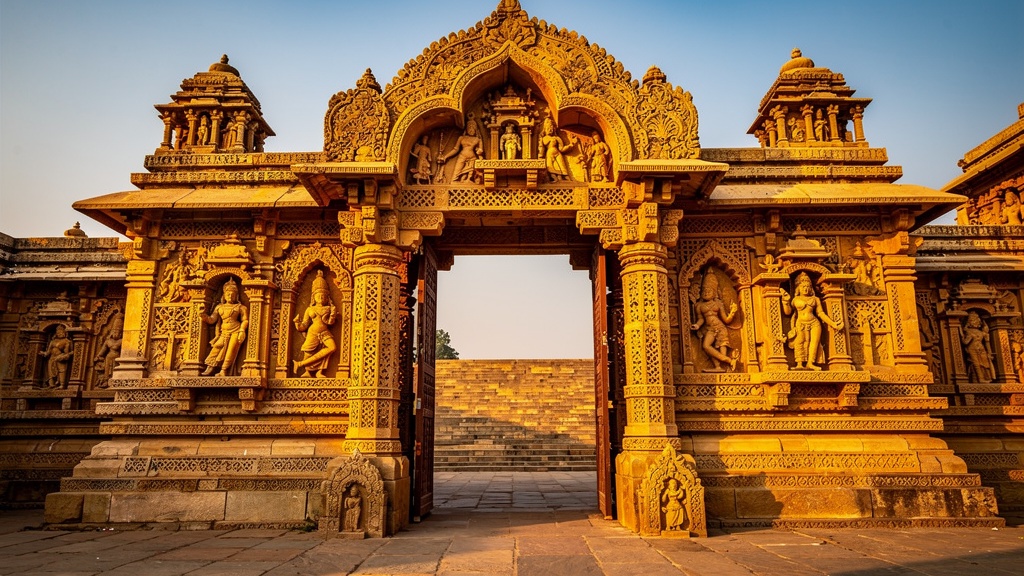 The intricately carved Torana archway of Modhera Sun Temple showing deity and dancer sculptures